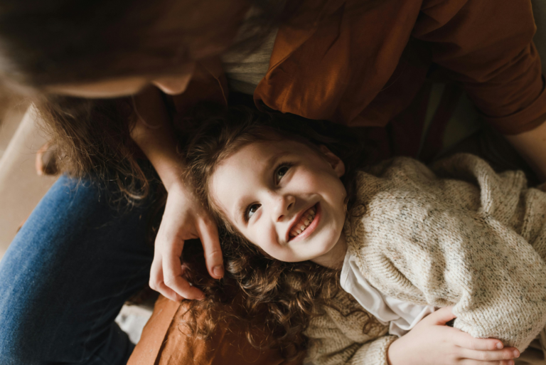 How people pleasing develops in childhood through early approval and emotional connection with caregivers
